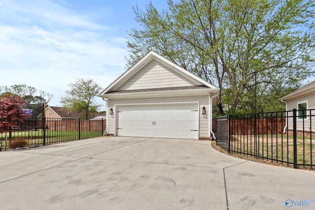 detached garage featuring fence