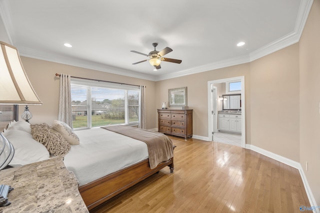 bedroom featuring connected bathroom, ceiling fan, light hardwood / wood-style floors, and crown molding