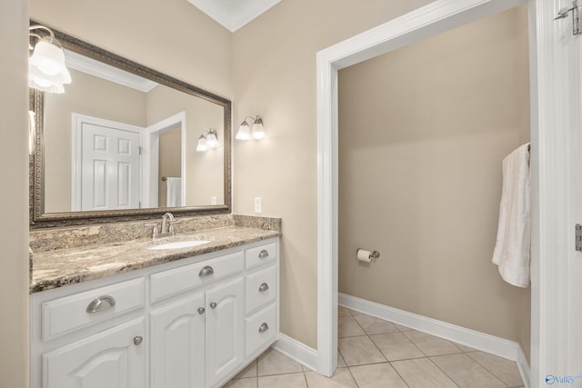 bathroom featuring vanity, tile patterned floors, and crown molding