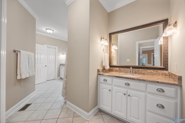 bathroom featuring vanity, tile patterned flooring, and crown molding