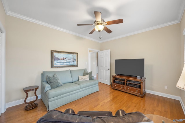 living room with ceiling fan, wood-type flooring, and crown molding