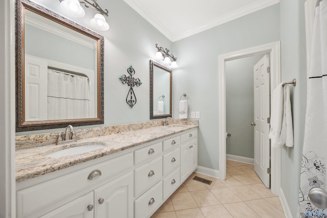 bathroom with vanity, tile patterned floors, and crown molding