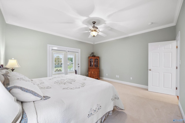 bedroom with ornamental molding, light colored carpet, and ceiling fan