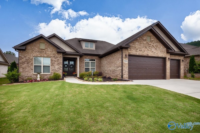 3011 Chimney Cove Cir, Brownsboro, AL 35741 - craftsman inspired home with brick siding, an attached garage, a front yard, and concrete driveway
