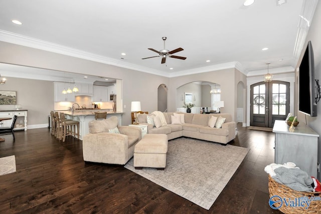 3011 Chimney Cove Cir, Brownsboro, AL 35741 - living room featuring arched walkways, recessed lighting, dark wood-style flooring, ceiling fan, and baseboards