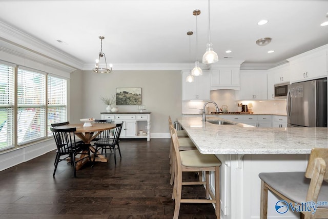 3011 Chimney Cove Cir, Brownsboro, AL 35741 - kitchen with freestanding refrigerator, built in microwave, a sink, dark wood-style floors, and white cabinets
