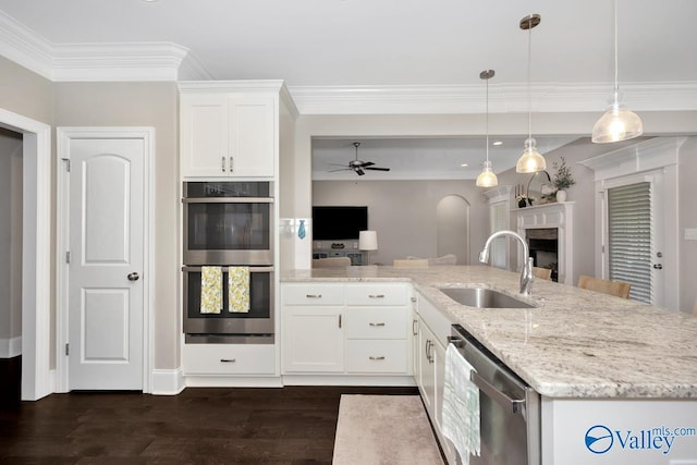 3011 Chimney Cove Cir, Brownsboro, AL 35741 - kitchen with appliances with stainless steel finishes, a sink, a ceiling fan, dark wood finished floors, and light stone counters