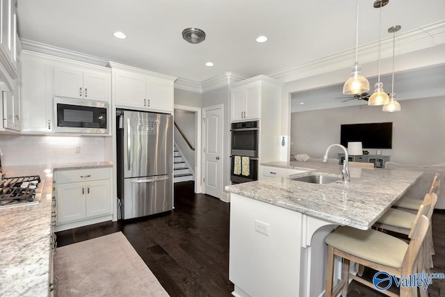 3011 Chimney Cove Cir, Brownsboro, AL 35741 - kitchen featuring stainless steel appliances, a sink, white cabinetry, backsplash, and light stone countertops