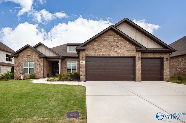 3011 Chimney Cove Cir, Brownsboro, AL 35741 - craftsman house with concrete driveway, brick siding, an attached garage, a front yard, and board and batten siding