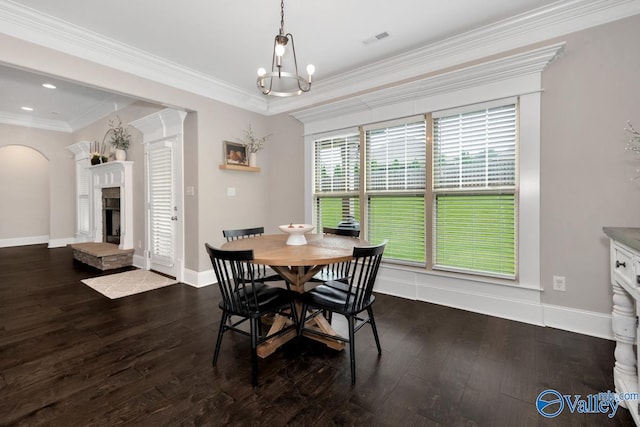 3011 Chimney Cove Cir, Brownsboro, AL 35741 - dining area with arched walkways, hardwood / wood-style flooring, a fireplace with raised hearth, baseboards, and a chandelier