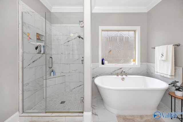 3011 Chimney Cove Cir, Brownsboro, AL 35741 - bathroom with marble tiled flooring, crown molding, a shower stall, a freestanding bath, and tile walls