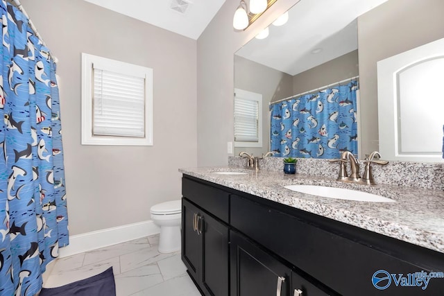 3011 Chimney Cove Cir, Brownsboro, AL 35741 - full bathroom with double vanity, marble look tiles, toilet, baseboards, and a shower with shower curtain