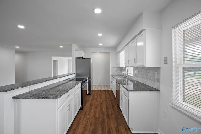 2707 Morgan St SW, Huntsville, AL 35805 - kitchen with white cabinetry, a sink, appliances with stainless steel finishes, dark wood-style floors, and recessed lighting