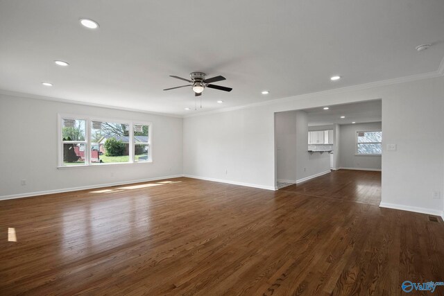 2707 Morgan St SW, Huntsville, AL 35805 - unfurnished living room featuring a healthy amount of sunlight, ornamental molding, and ceiling fan