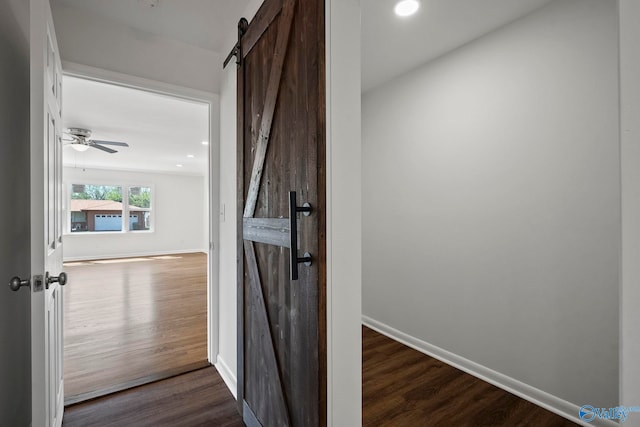 2707 Morgan St SW, Huntsville, AL 35805 - hallway with dark wood-style floors, a barn door, recessed lighting, and baseboards