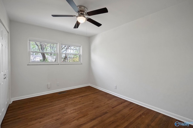 2707 Morgan St SW, Huntsville, AL 35805 - unfurnished bedroom with a closet, ceiling fan, visible vents, baseboards, and wood finished floors