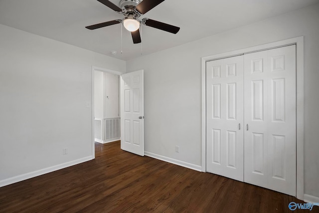 2707 Morgan St SW, Huntsville, AL 35805 - unfurnished bedroom featuring baseboards, ceiling fan, dark wood-style flooring, and a closet