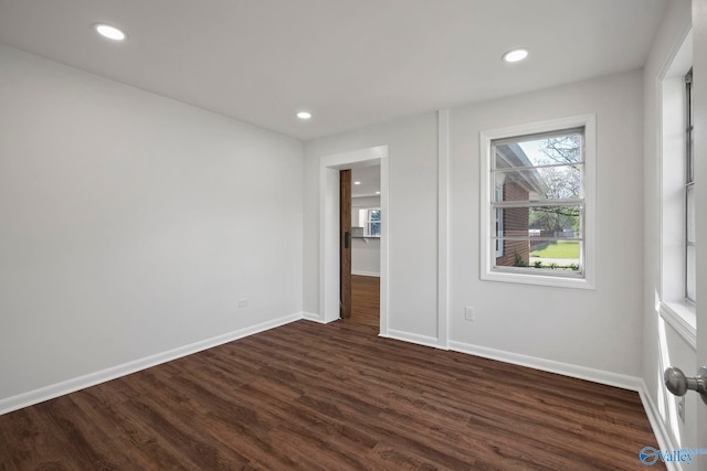 2707 Morgan St SW, Huntsville, AL 35805 - unfurnished bedroom with recessed lighting, dark wood-style flooring, and baseboards