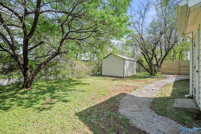2707 Morgan St SW, Huntsville, AL 35805 - view of yard with fence, an outdoor structure, and a storage shed