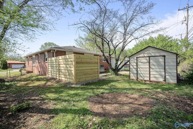 2707 Morgan St SW, Huntsville, AL 35805 - view of yard featuring fence, an outdoor structure, and a shed
