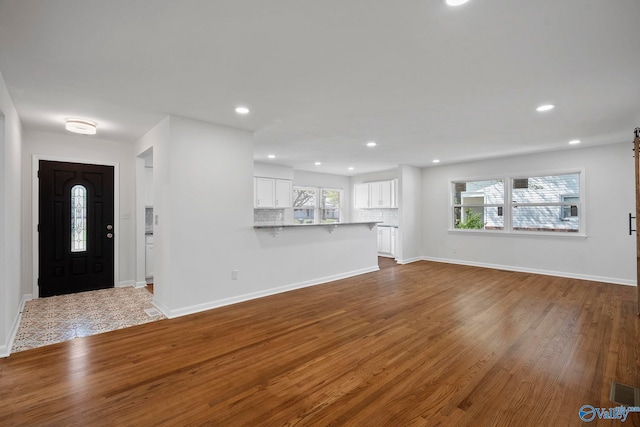 2707 Morgan St SW, Huntsville, AL 35805 - foyer entrance featuring baseboards, recessed lighting, wood finished floors, and plenty of natural light