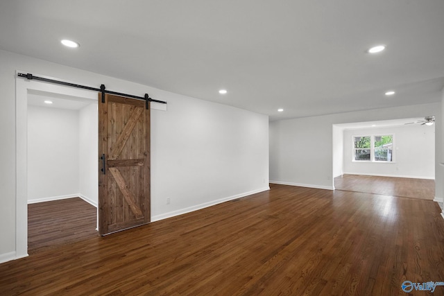 2707 Morgan St SW, Huntsville, AL 35805 - interior space featuring a barn door, dark wood-style floors, baseboards, recessed lighting, and a ceiling fan