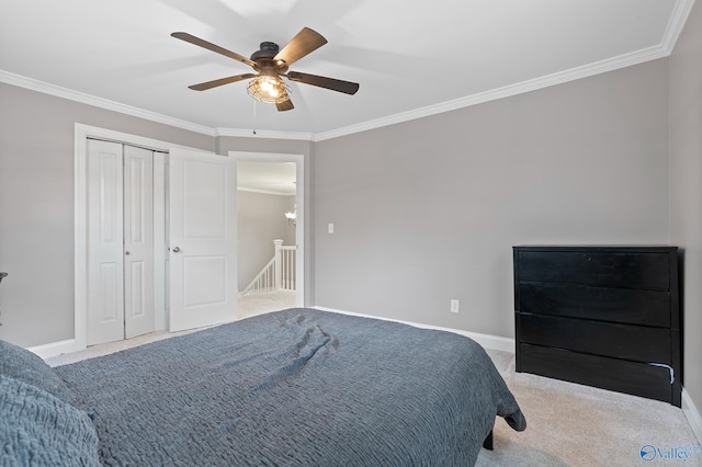 carpeted bedroom with crown molding, a closet, and ceiling fan