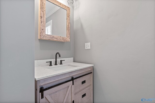 bathroom featuring vanity and crown molding