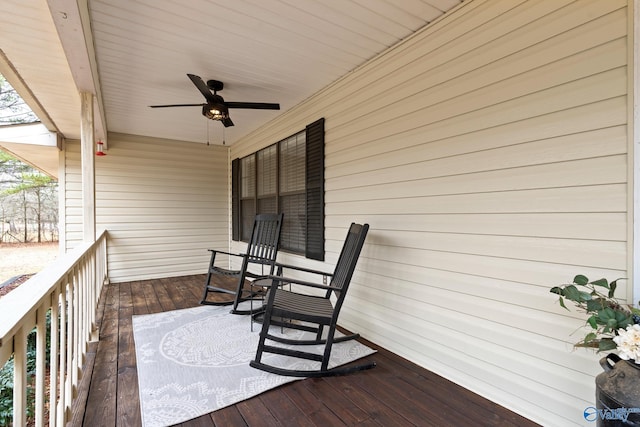 wooden deck with ceiling fan and a porch