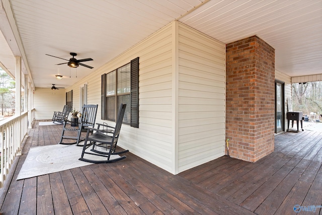 deck with covered porch and ceiling fan