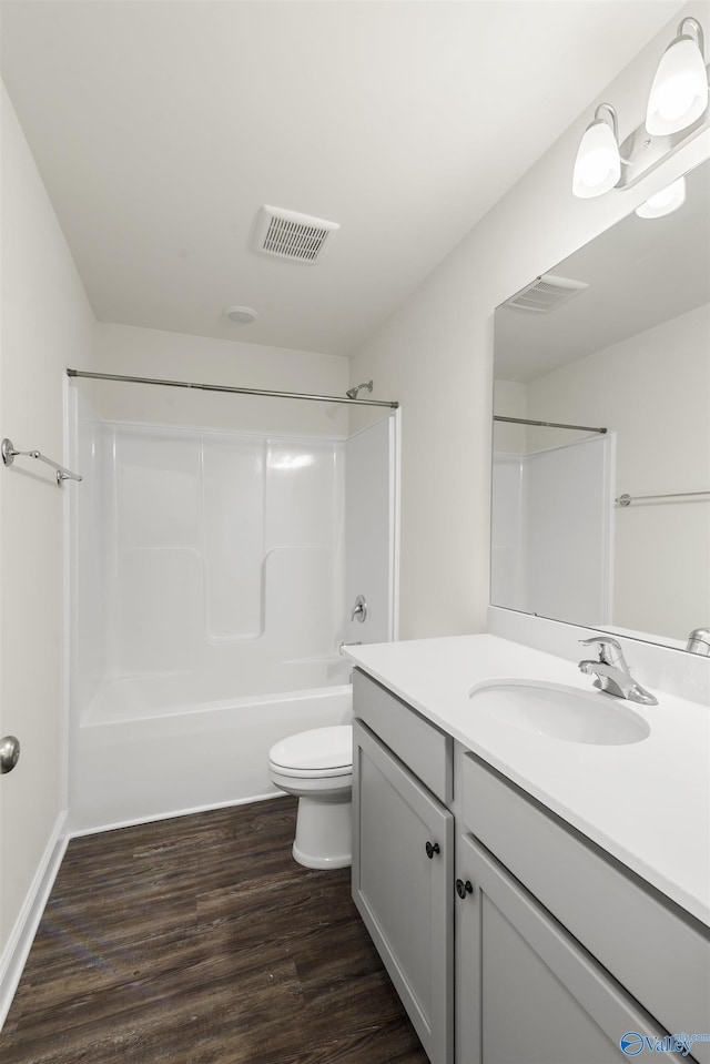 228 Cherry Laurel Dr, Hazel Green, AL 35750 - full bath featuring vanity, wood finished floors, and shower / bath combination