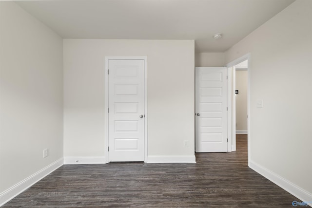228 Cherry Laurel Dr, Hazel Green, AL 35750 - unfurnished bedroom with dark wood-style floors