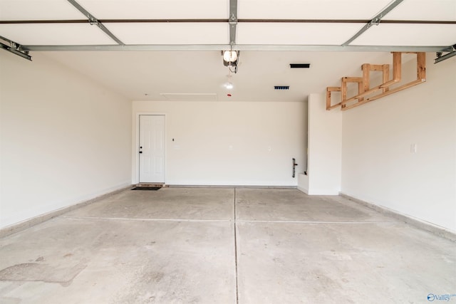 228 Cherry Laurel Dr, Hazel Green, AL 35750 - garage featuring a garage door opener and baseboards