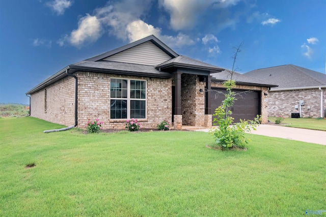228 Cherry Laurel Dr, Hazel Green, AL 35750 - single story home with brick siding, an attached garage, a front yard, and concrete driveway