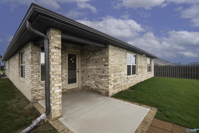 228 Cherry Laurel Dr, Hazel Green, AL 35750 - doorway to property featuring a patio and brick siding
