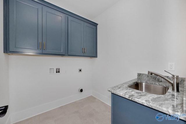 laundry room with a sink, electric dryer hookup, cabinet space, baseboards, and washer hookup