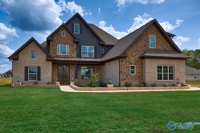 craftsman-style home with stone siding, a standing seam roof, a front lawn, and brick siding