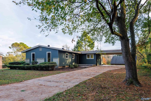 ranch-style house with a carport