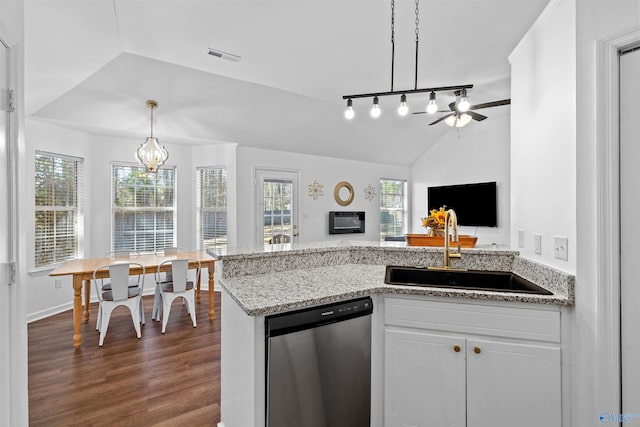 kitchen with lofted ceiling, a wealth of natural light, a peninsula, stainless steel dishwasher, and a sink