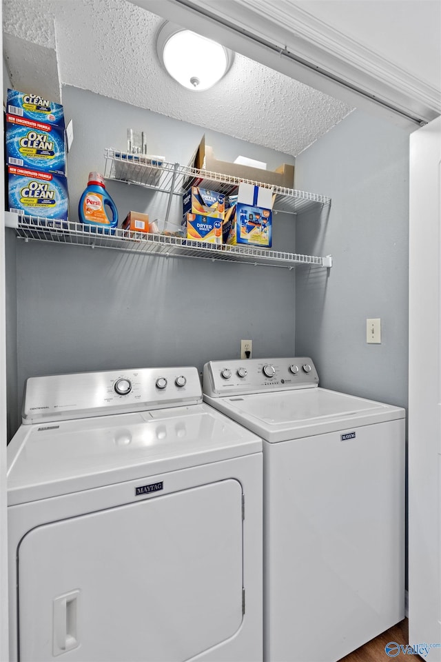 clothes washing area with laundry area and washer and clothes dryer