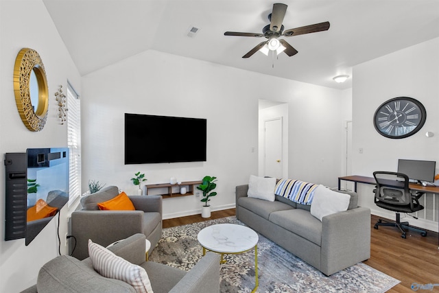 living room with visible vents, ceiling fan, lofted ceiling, and wood finished floors