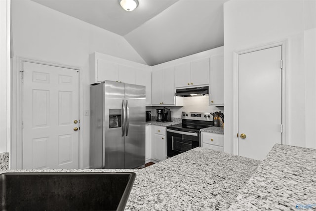 kitchen with vaulted ceiling, under cabinet range hood, appliances with stainless steel finishes, white cabinetry, and tasteful backsplash