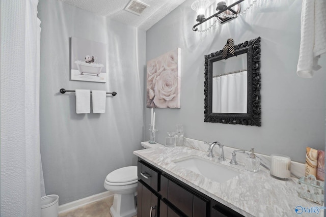 full bathroom with visible vents, baseboards, toilet, tile patterned flooring, and vanity