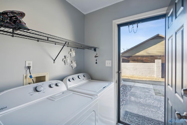 clothes washing area featuring laundry area and washing machine and clothes dryer