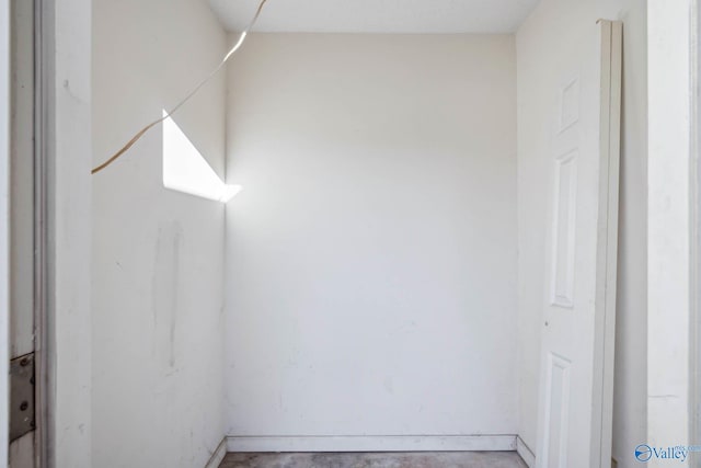 spare room with unfinished concrete floors