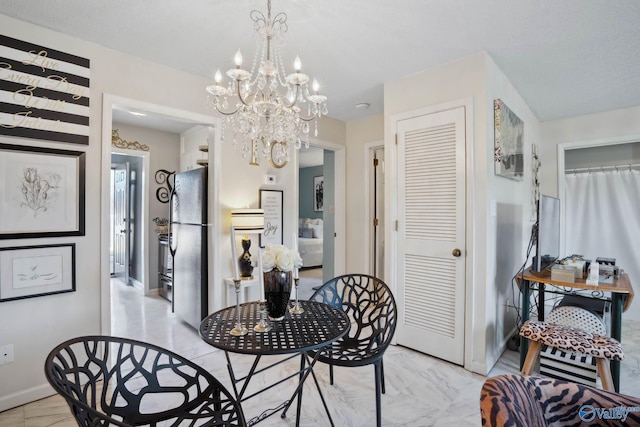dining room featuring marble finish floor and baseboards