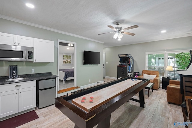 228 George Byrd Dr, Owens Cross Roads, AL 35763 - game room featuring a ceiling fan, recessed lighting, crown molding, and baseboards