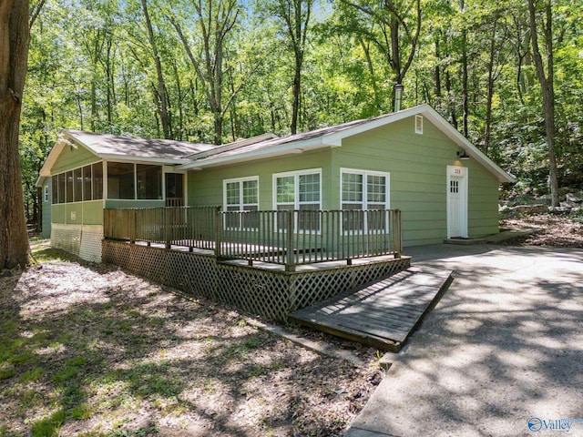 228 George Byrd Dr, Owens Cross Roads, AL 35763 - view of front of property with a sunroom and a deck