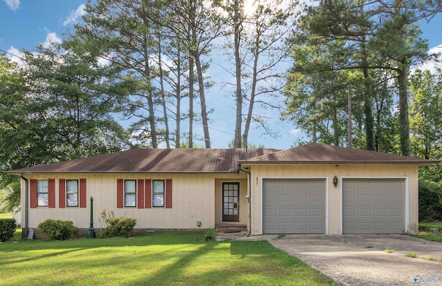 ranch-style house with a garage and a front lawn