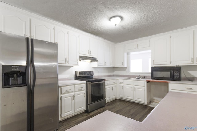 kitchen with sink, dark wood-type flooring, stainless steel appliances, and white cabinets